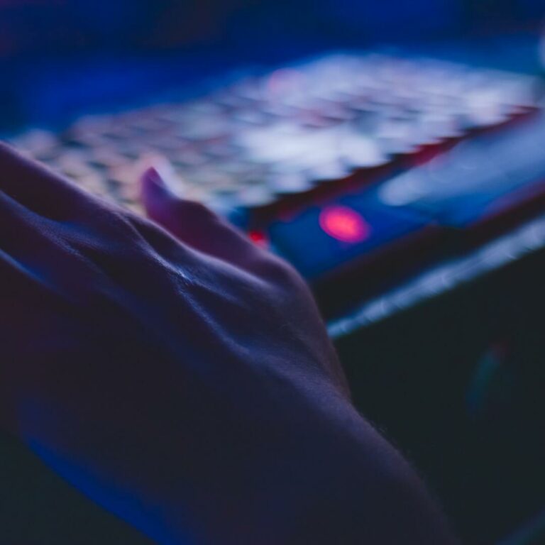 blurry image of a hand resting on a keyboard
