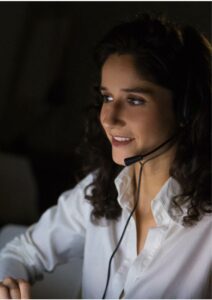 woman in white blouse with headset on