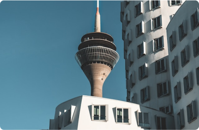 photo of the TV tower next to some apartment buildings in Germany