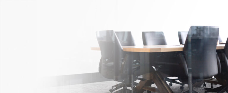 conference room table with black rolling chairs